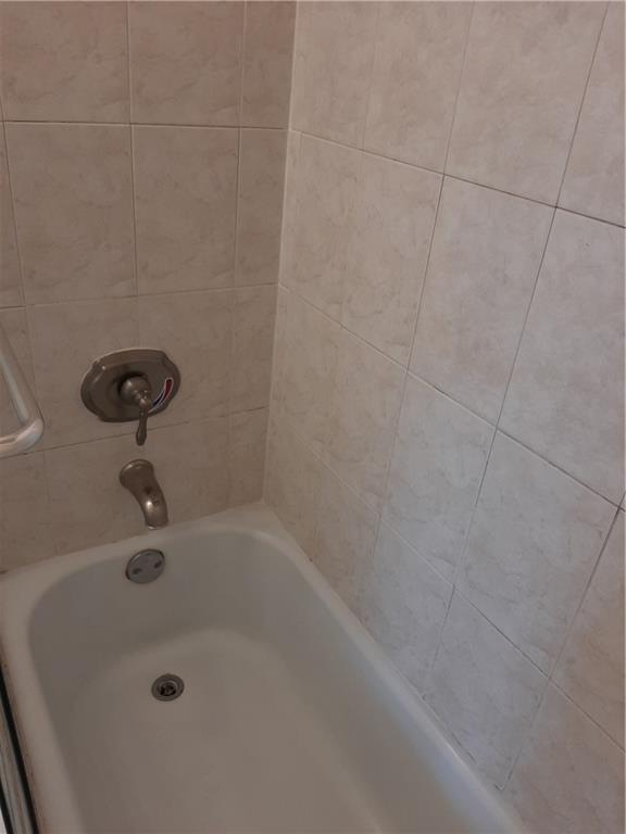 3650 Inverrary Drive, Unit 3Q Lauderhill, FL 33319 - Photo 8 of 16 a bathroom with a bathtub
