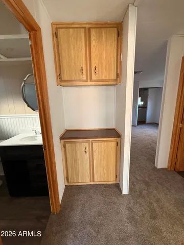 a bathroom with a sink toilet and a mirror