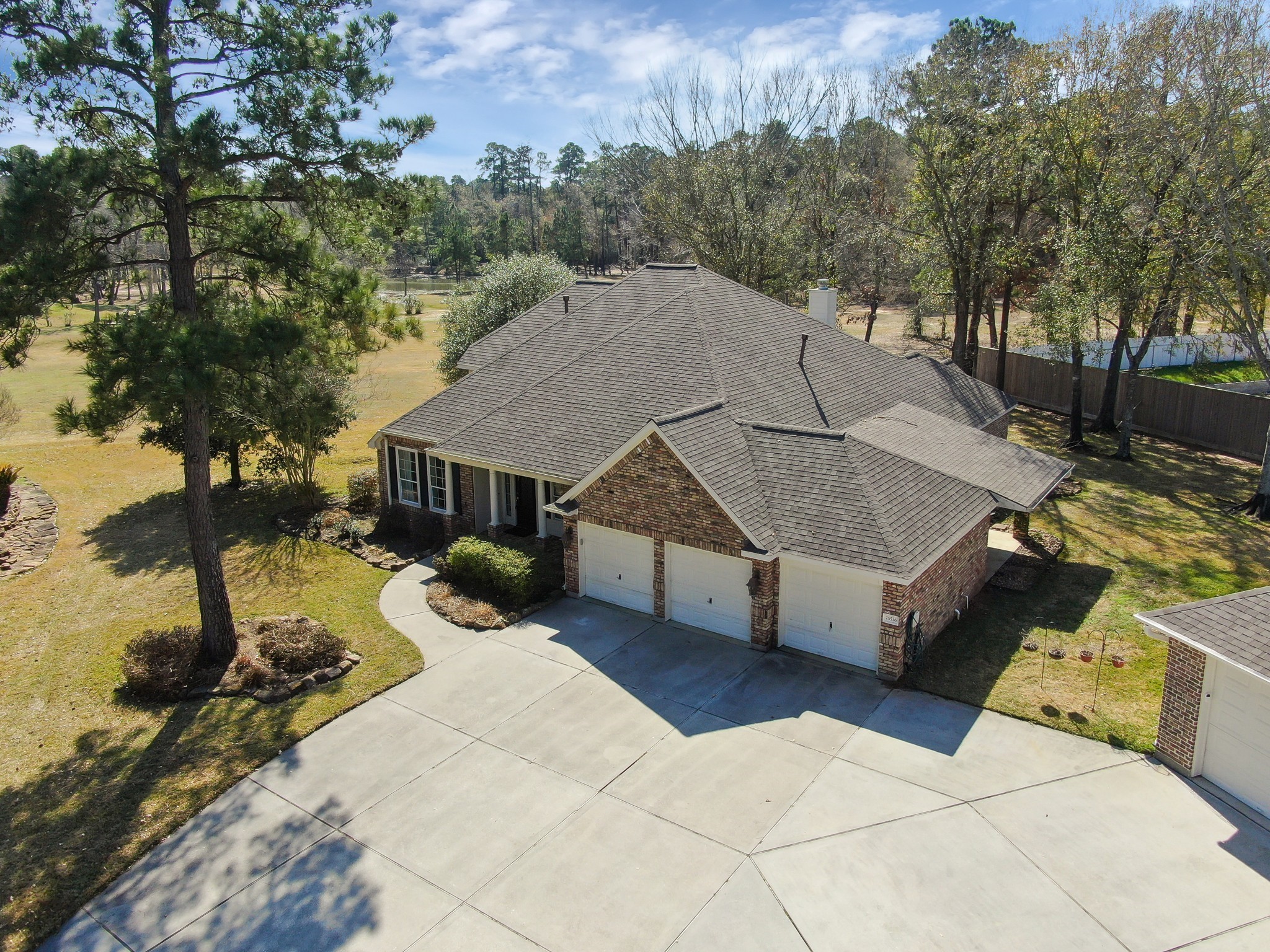 a view of a house with a yard and sitting area