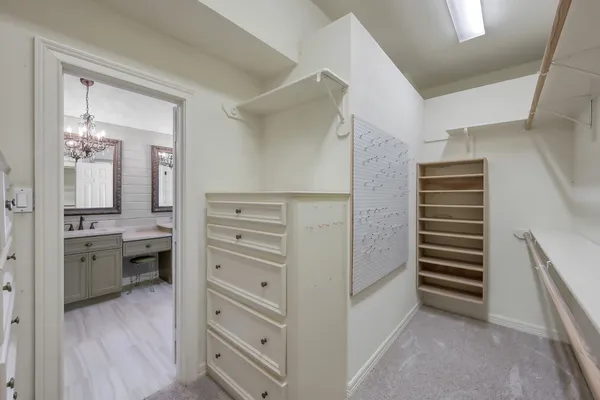a view of a walk in closet and bedroom