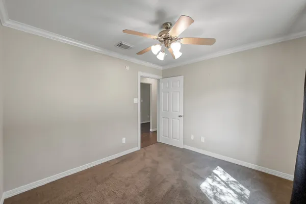 a view of a chandelier fan in a room