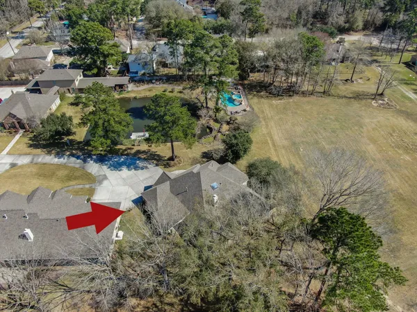 an aerial view of residential houses with outdoor space
