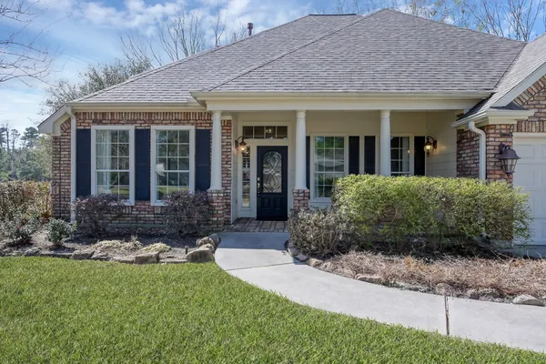 a view of a house with garden and plants