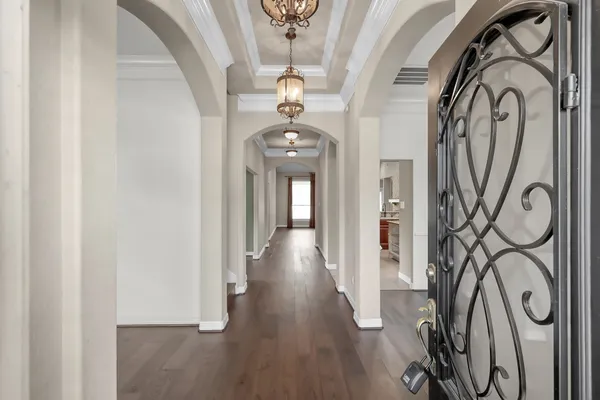 a view of an entryway with wooden floor