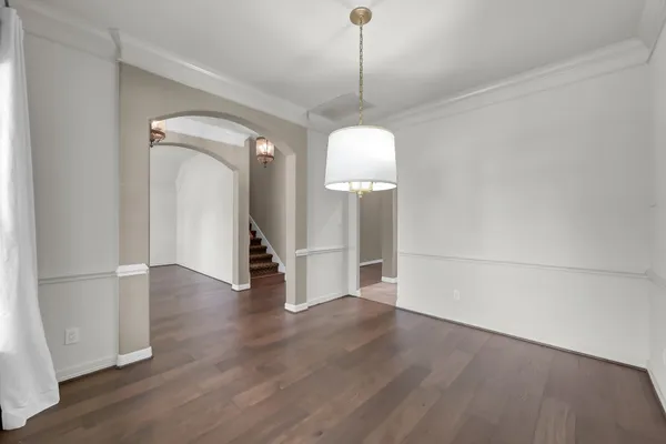a view of a room with wooden floor and staircase