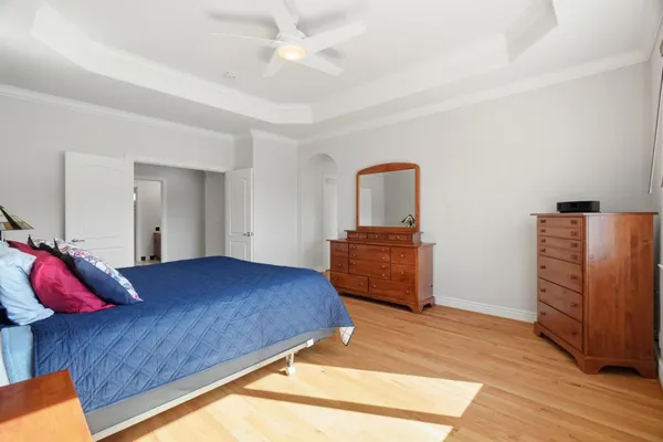 a bathroom with a sink double vanity granite tub and a large mirror