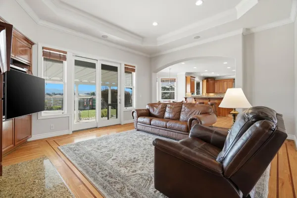 a view of a dining room with furniture and wooden floor