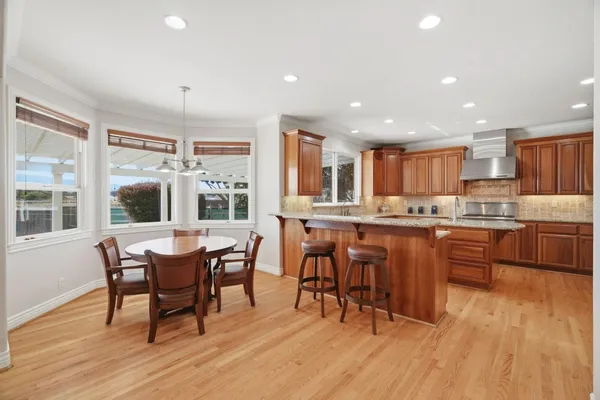 a view of a dining room with furniture window and wooden floor