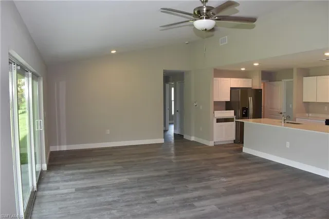 a view of kitchen with wooden floor and window