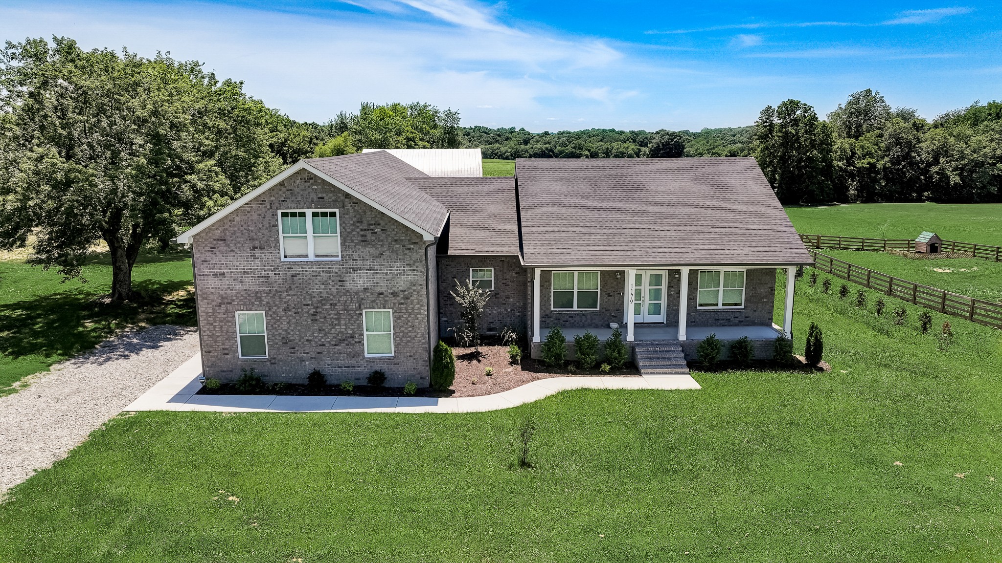 1179 Payne Road Portland, TN 37148 - Photo 1 of 34 a view of a house with a yard and sitting area