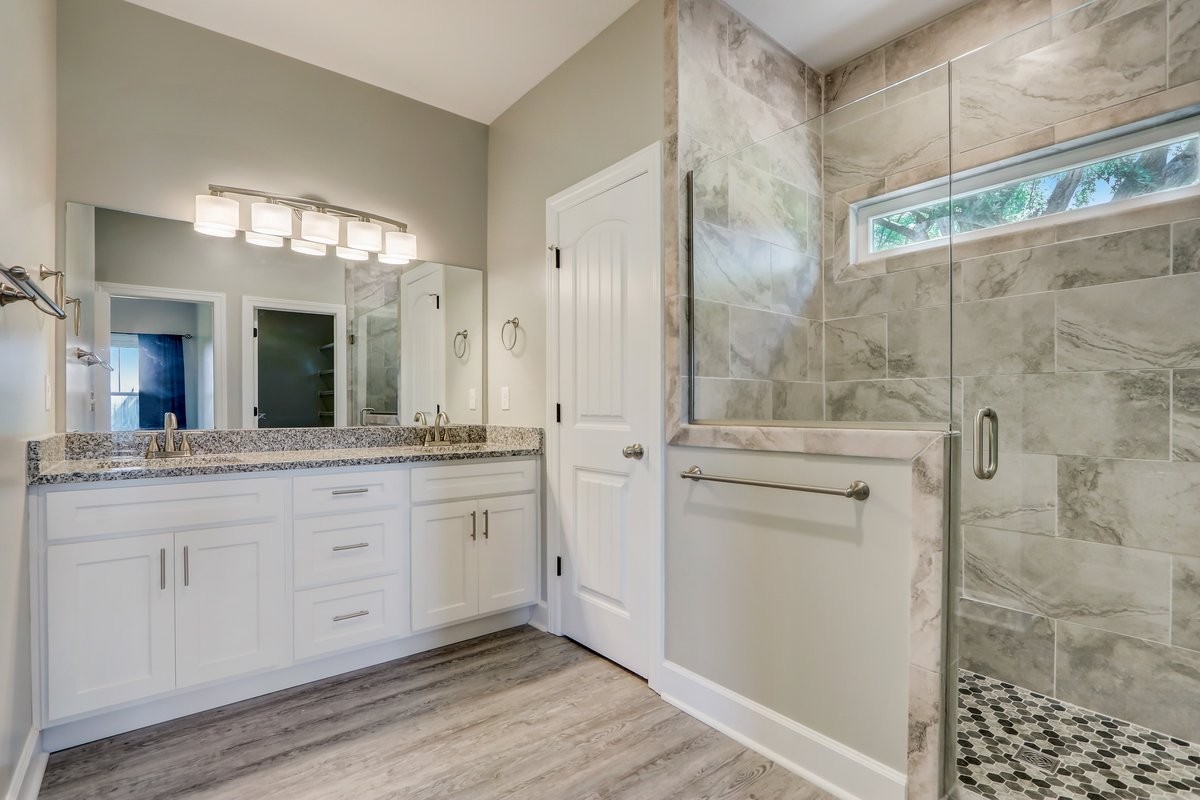 1179 Payne Road Portland, TN 37148 - Photo 12 of 34 a spacious bathroom with a granite countertop sink mirror and shower