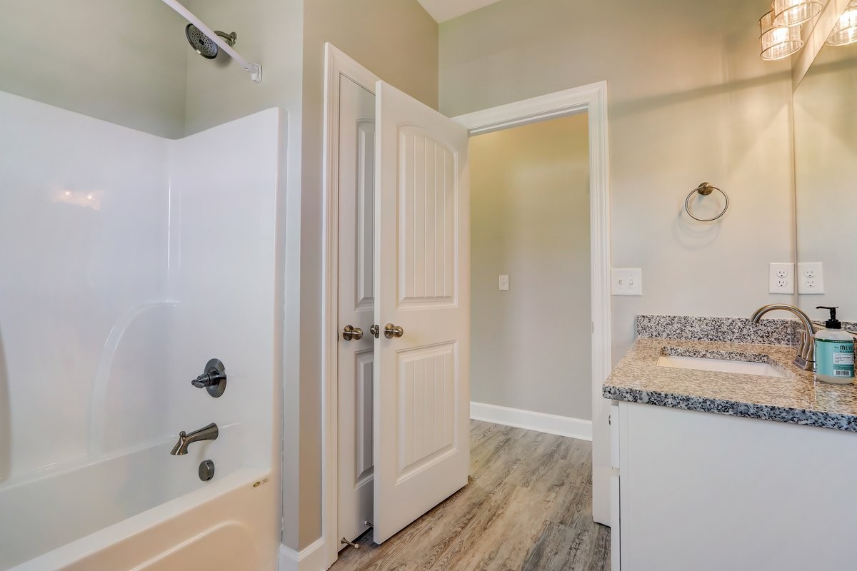 1179 Payne Road Portland, TN 37148 - Photo 20 of 34 a bathroom with a granite countertop sink and a mirror