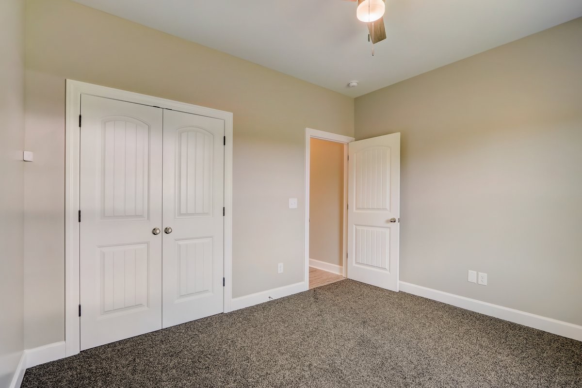 1179 Payne Road Portland, TN 37148 - Photo 21 of 34 a view of an empty room and chandelier fan