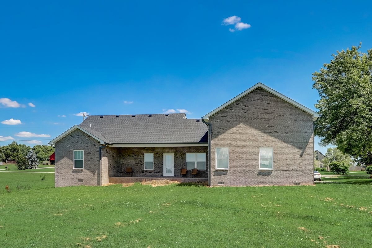 1179 Payne Road Portland, TN 37148 - Photo 25 of 34 a front view of a house with a garden