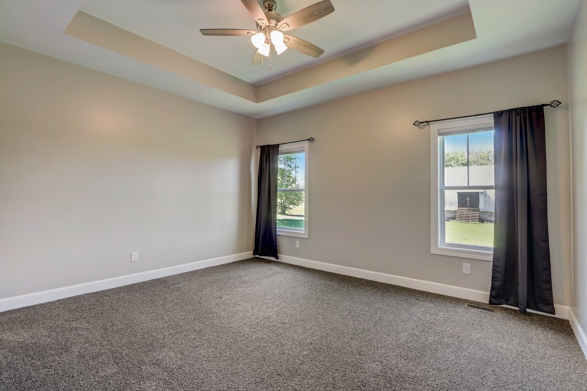1179 Payne Road Portland, TN 37148 - Photo 10 of 34 an empty room with windows and fan