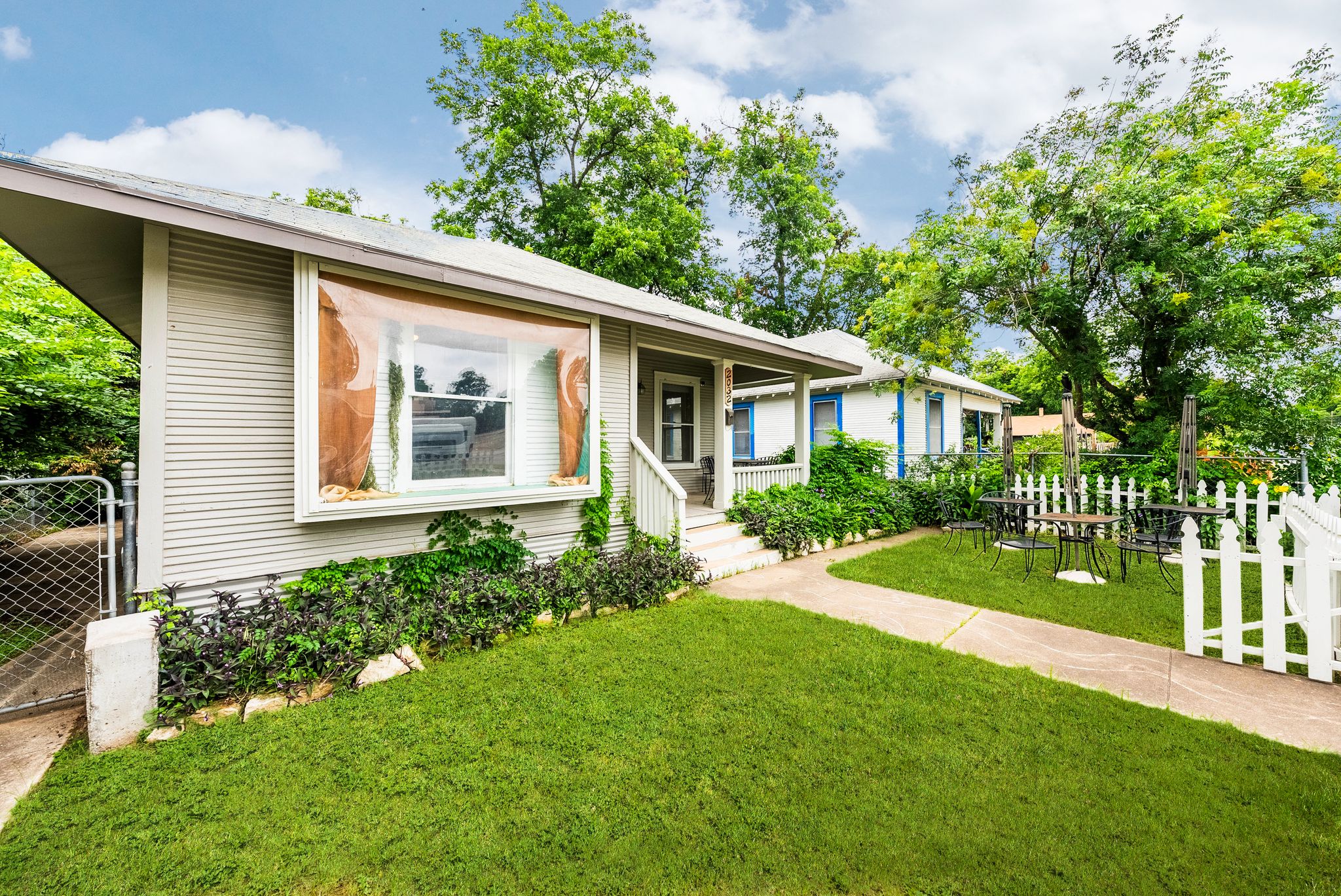 2032 East Cesar Chavez Street Austin, TX 78702 - Photo 19 of 25 a view of a house with a yard and garden