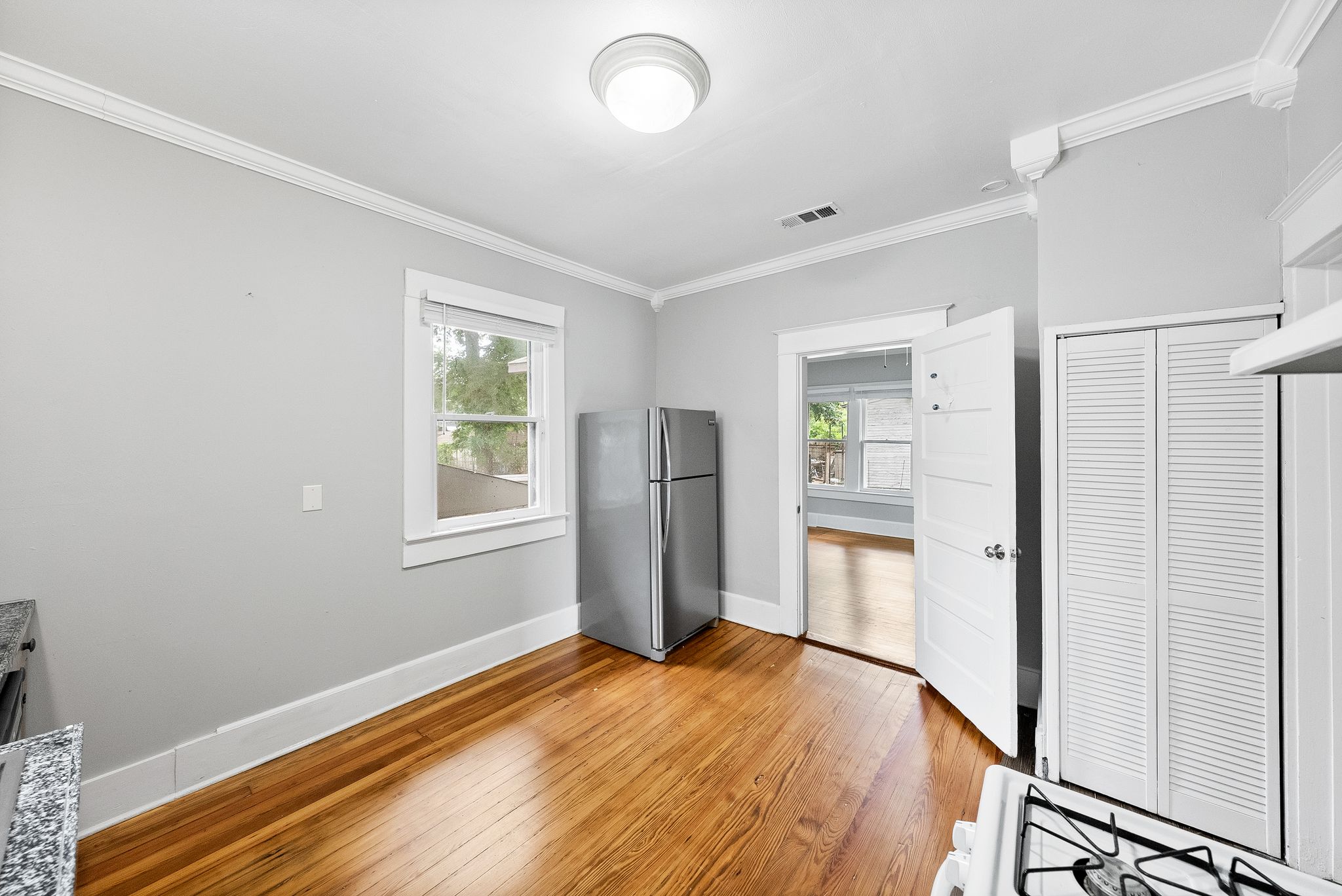2032 East Cesar Chavez Street Austin, TX 78702 - Photo 10 of 25 a bedroom with a bed and a window