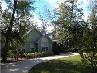 164 Blue Heron Road Santa Rosa Beach, FL 32459 - Photo 1 of 12 a front view of house with yard and green space