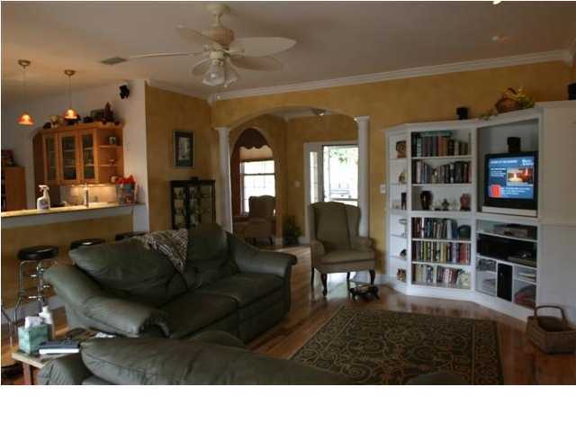 164 Blue Heron Road Santa Rosa Beach, FL 32459 - Photo 3 of 12 a living room with furniture and a fireplace