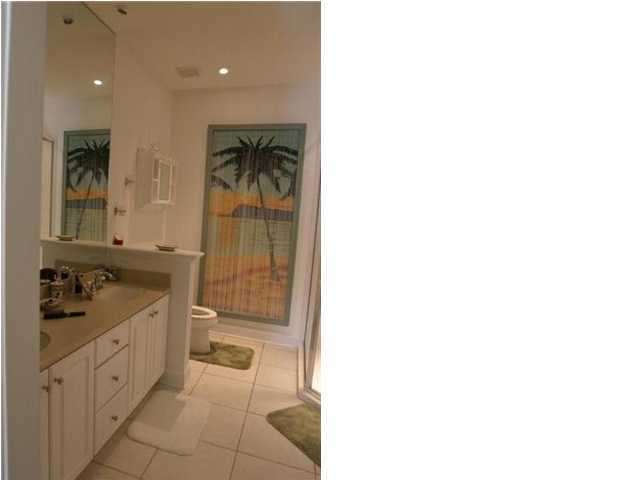 164 Blue Heron Road Santa Rosa Beach, FL 32459 - Photo 9 of 12 a bathroom with a sink a toilet and shower