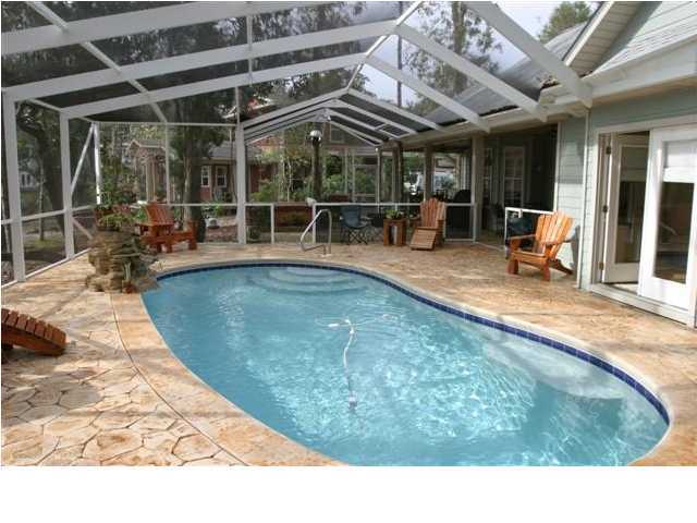 164 Blue Heron Road Santa Rosa Beach, FL 32459 - Photo 10 of 12 a view of a swimming pool with a patio