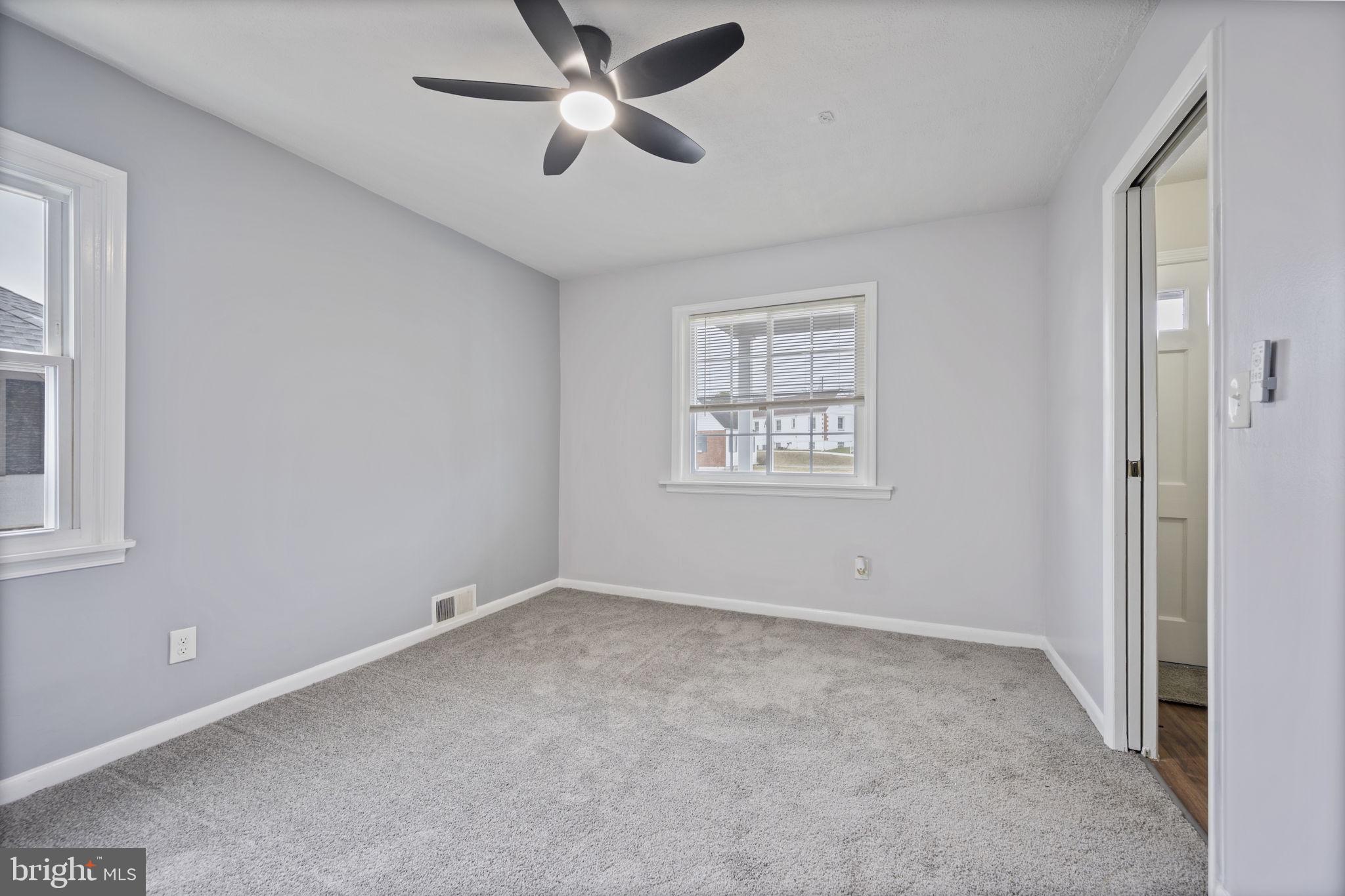 417 Meadow Road Baltimore, MD 21206 - Photo 13 of 47 a view of an empty room with a window