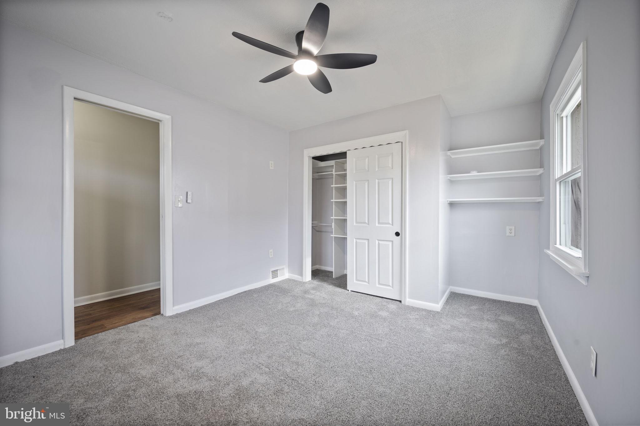 417 Meadow Road Baltimore, MD 21206 - Photo 14 of 47 a view of empty room with ceiling fan