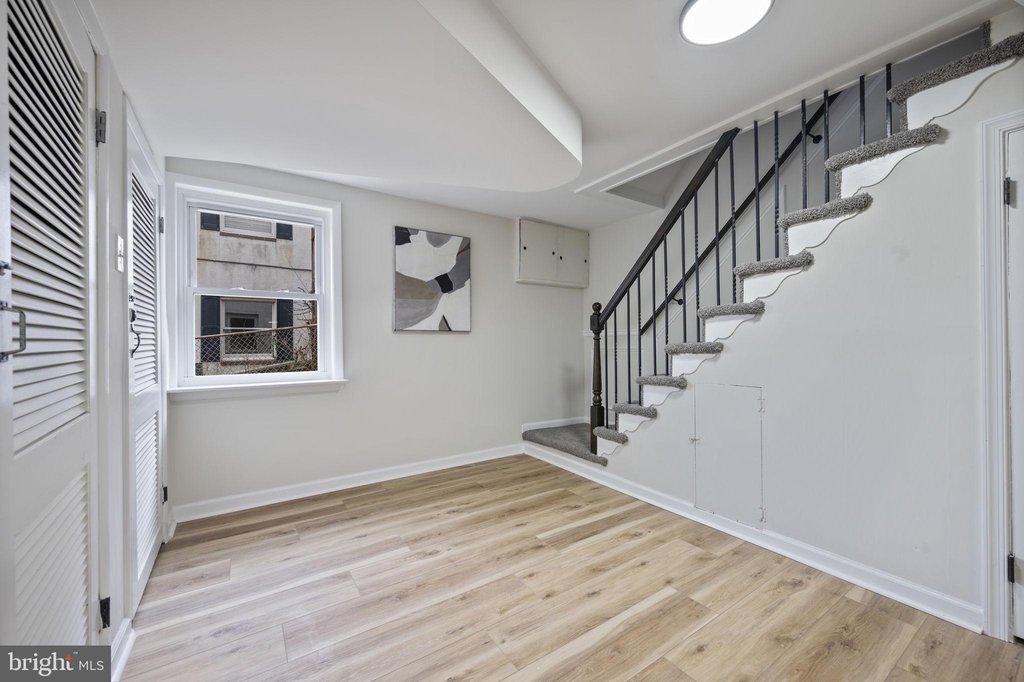 417 Meadow Road Baltimore, MD 21206 - Photo 20 of 47 a view of a hallway with wooden floor and entryway