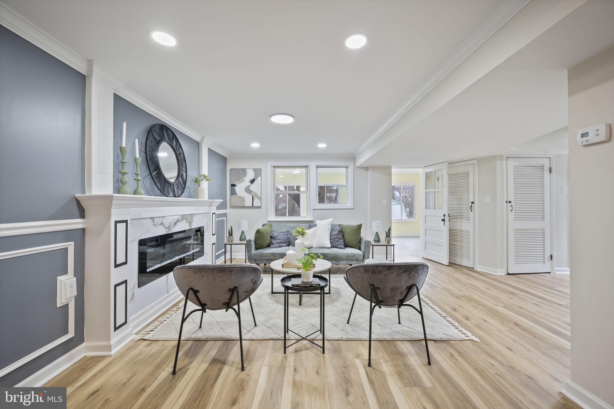 417 Meadow Road Baltimore, MD 21206 - Photo 23 of 47 a living room with furniture and a fireplace