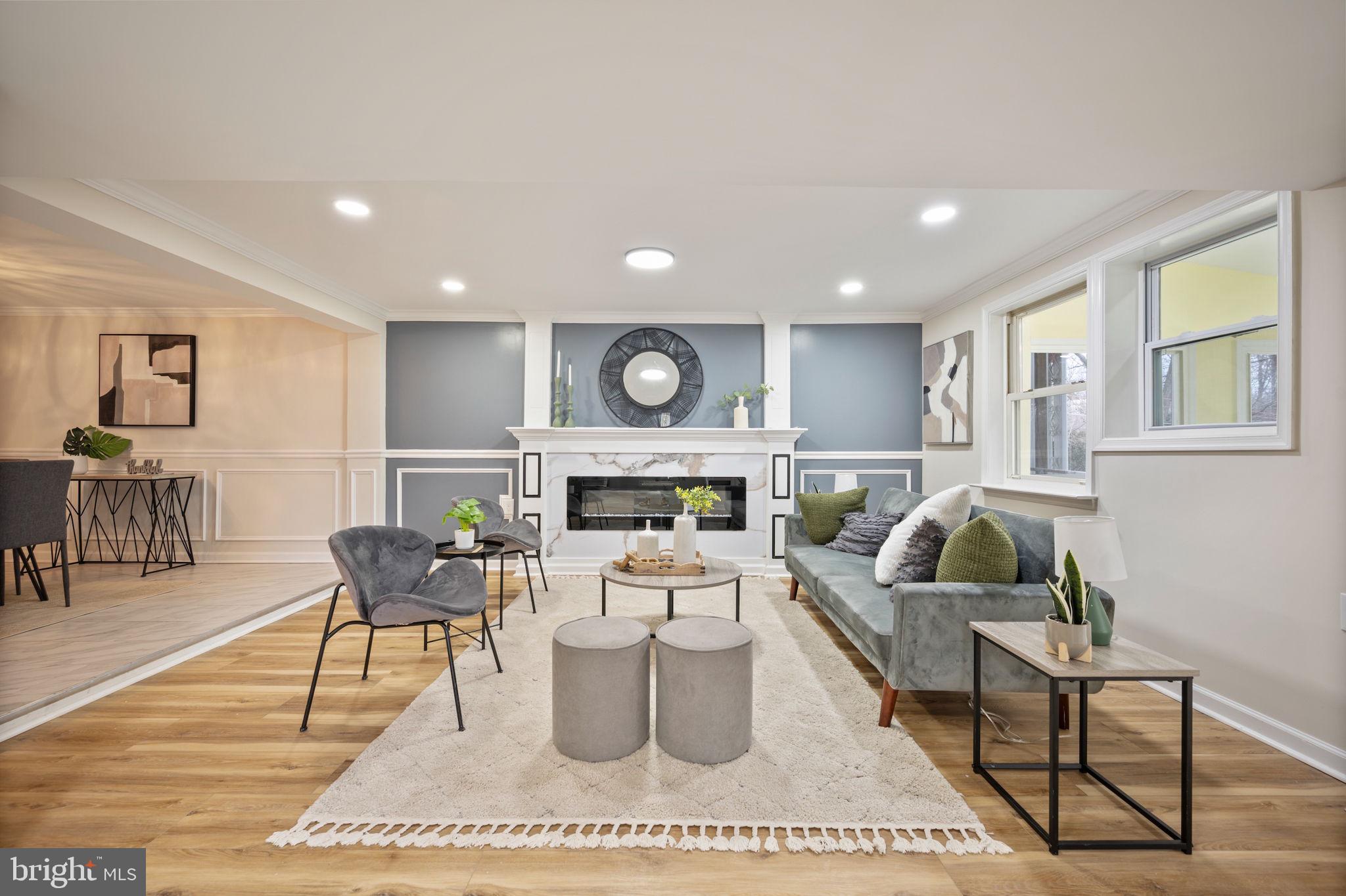 417 Meadow Road Baltimore, MD 21206 - Photo 24 of 47 a living room with furniture a rug kitchen view and a fireplace