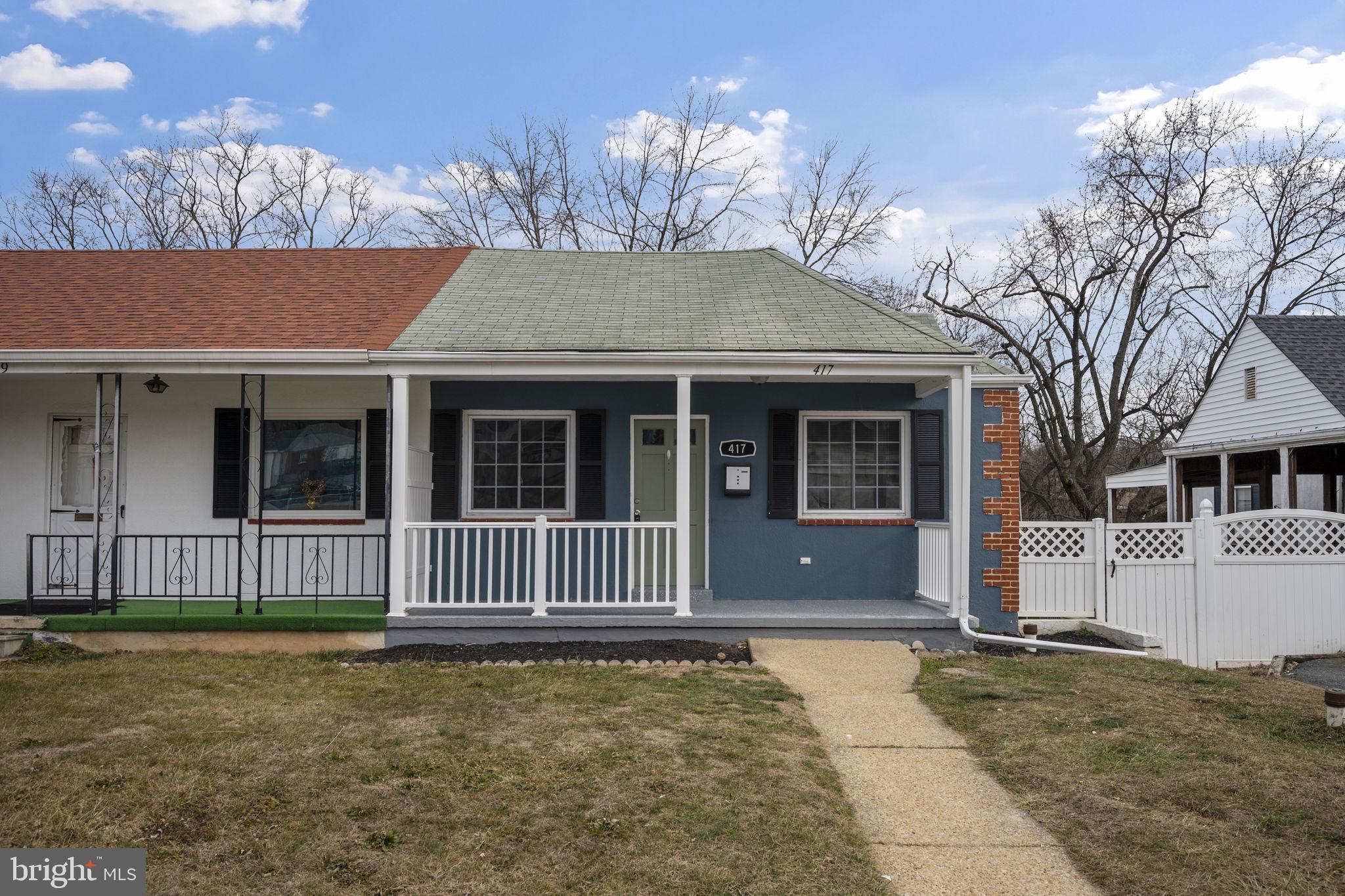 417 Meadow Road Baltimore, MD 21206 - Photo 3 of 47 a front view of a house with garden