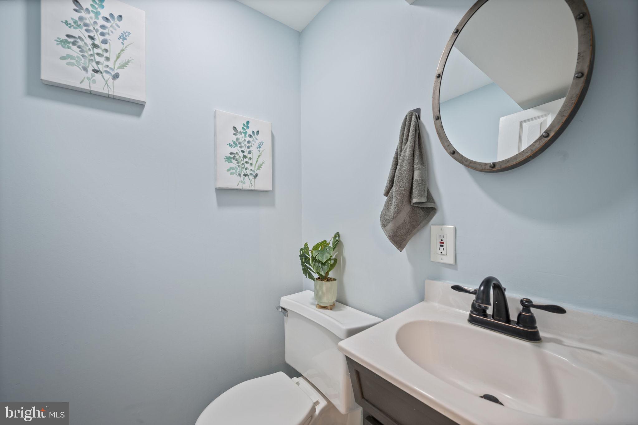 417 Meadow Road Baltimore, MD 21206 - Photo 31 of 47 a bathroom with a sink and a mirror