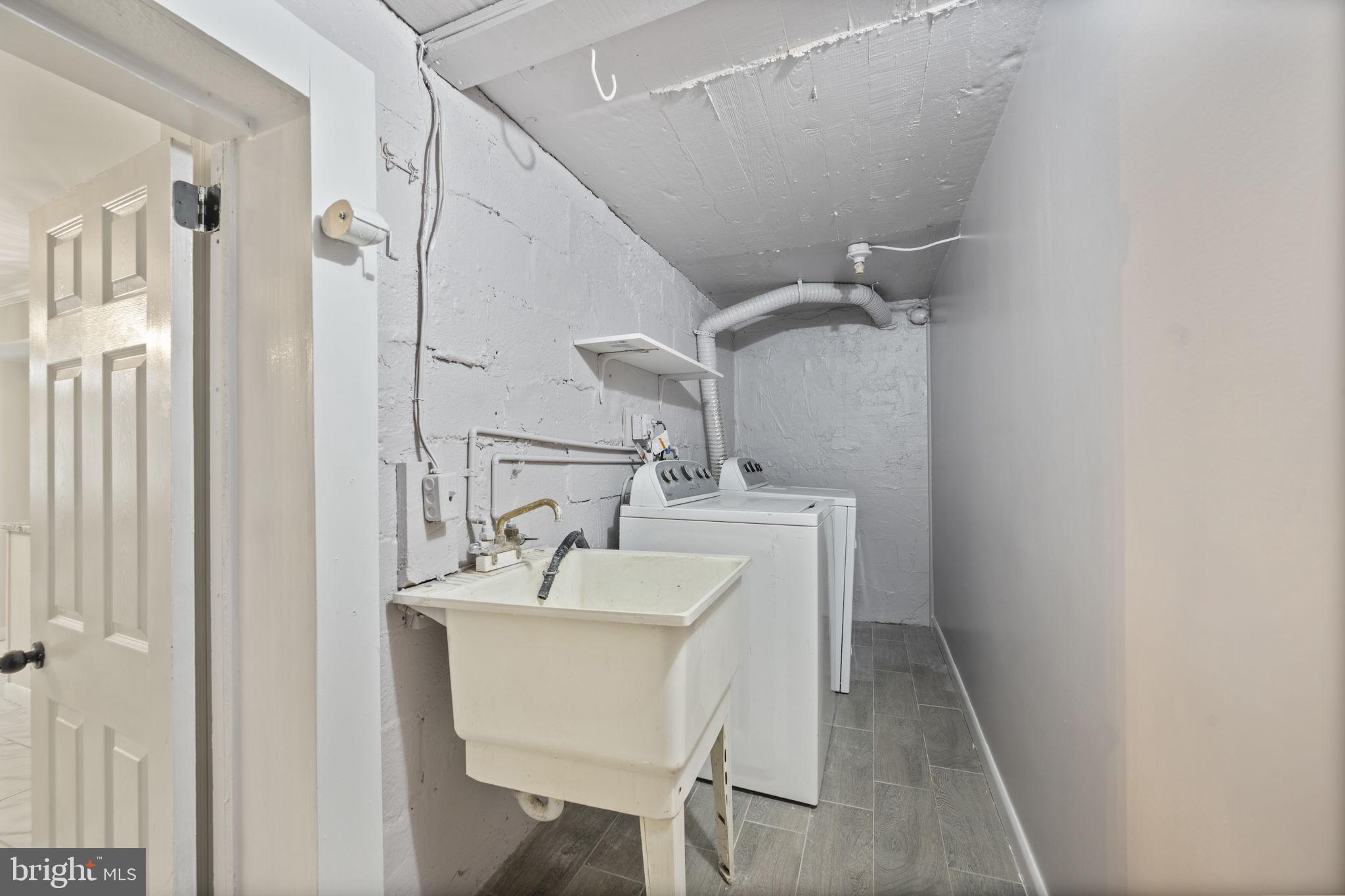 417 Meadow Road Baltimore, MD 21206 - Photo 32 of 47 a bathroom with a sink and a mirror