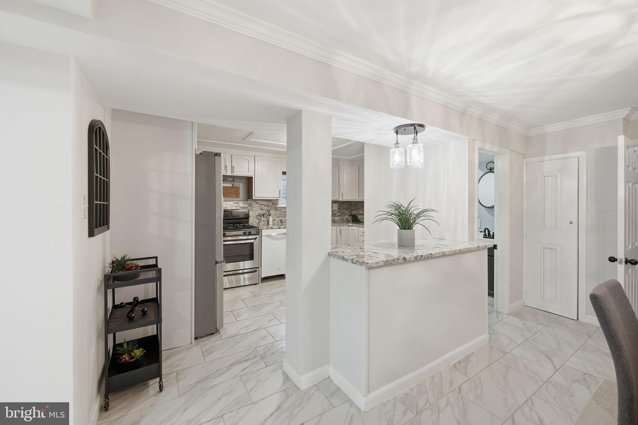 417 Meadow Road Baltimore, MD 21206 - Photo 36 of 47 a view of kitchen with refrigerator and cabinets