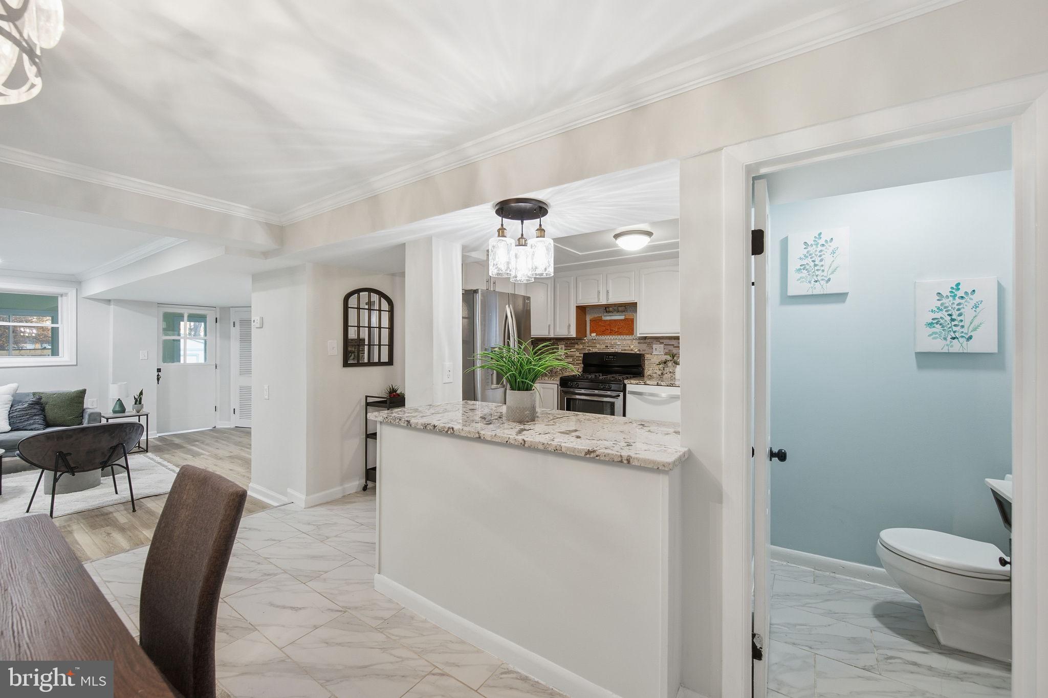 417 Meadow Road Baltimore, MD 21206 - Photo 37 of 47 a living room with furniture and a wooden floor