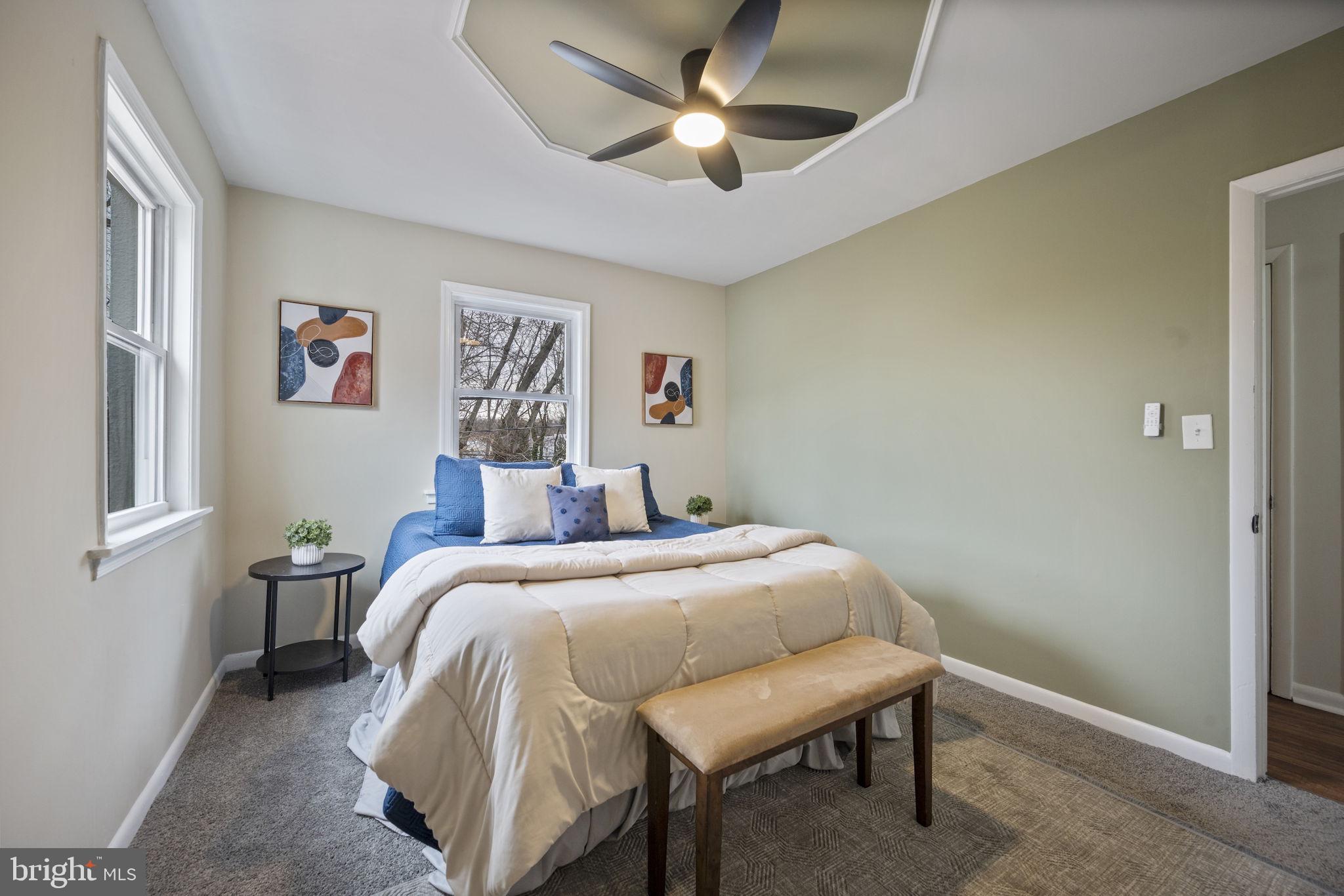 417 Meadow Road Baltimore, MD 21206 - Photo 5 of 47 a bed room with a bed and a painting on the wall