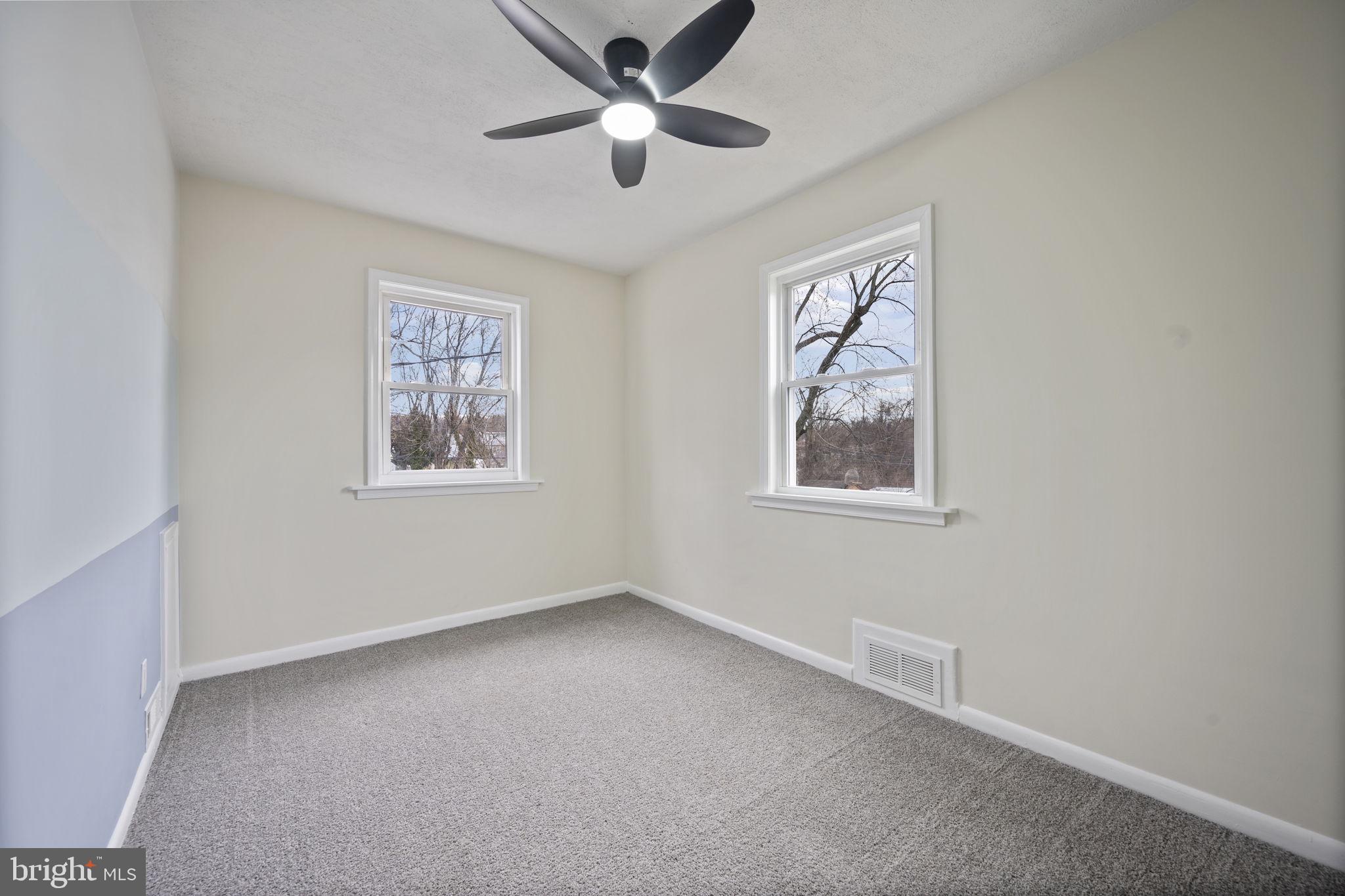 417 Meadow Road Baltimore, MD 21206 - Photo 7 of 47 a view of room with window and ceiling fan