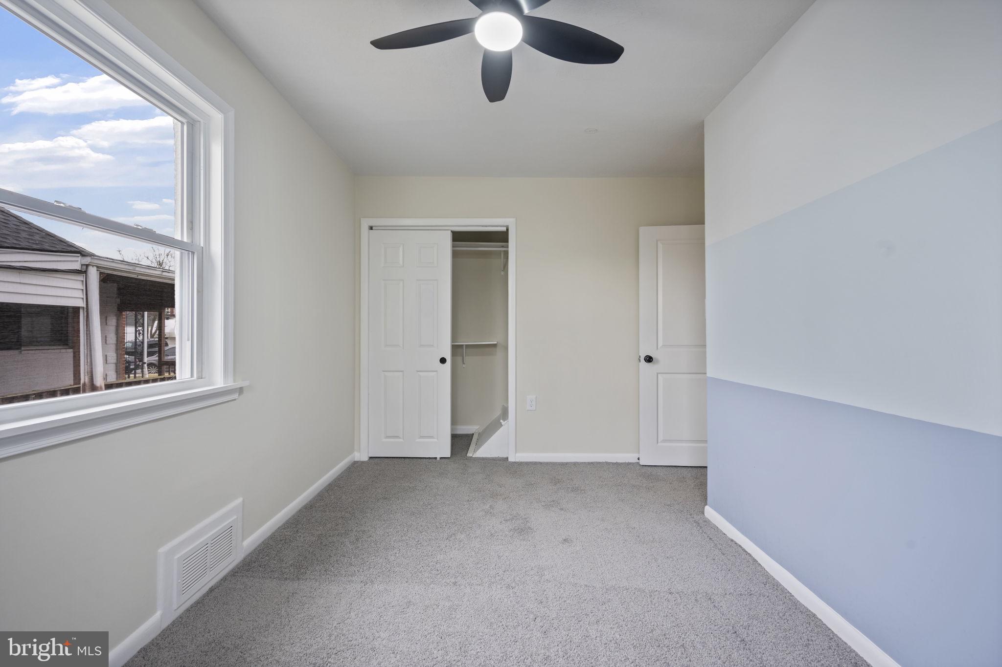 417 Meadow Road Baltimore, MD 21206 - Photo 8 of 47 a view of an empty room with a window