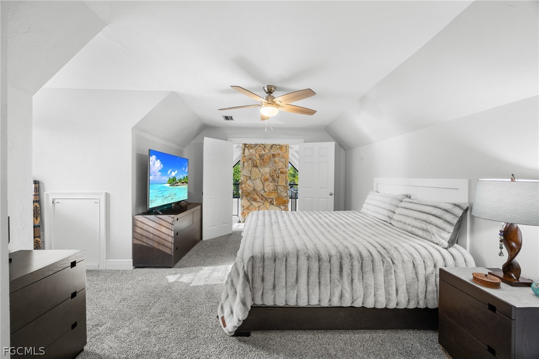 12991 Iona Road Fort Myers, FL 33908 - Photo 16 of 43 a bedroom with a bed and a flat screen tv