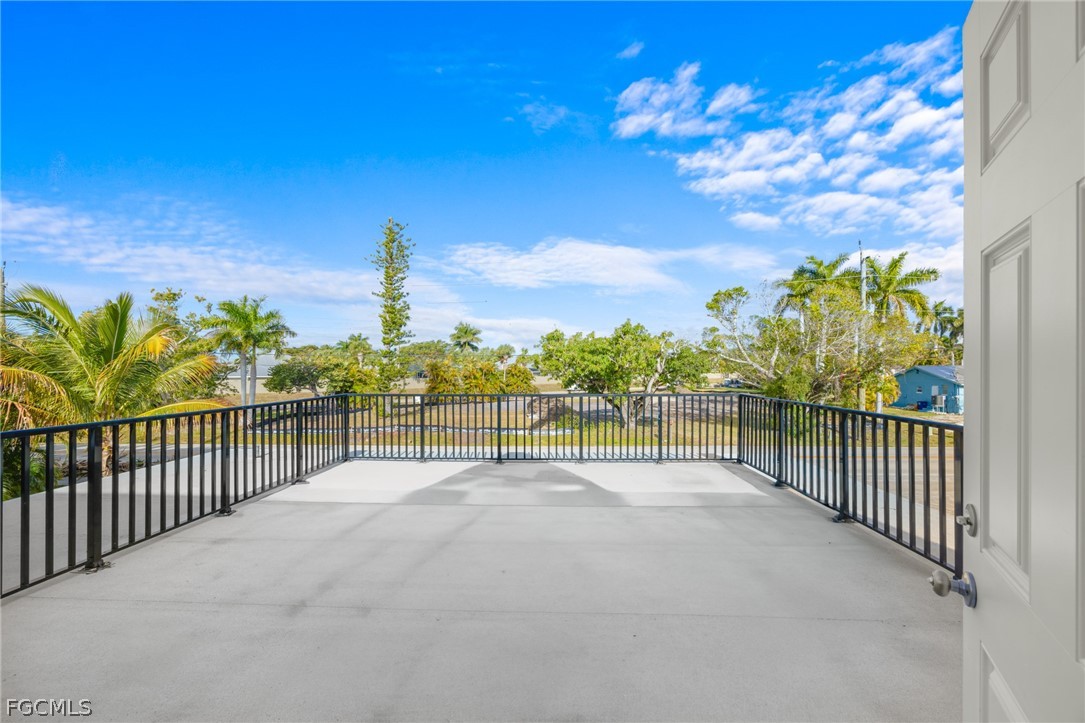 12991 Iona Road Fort Myers, FL 33908 - Photo 24 of 43 a view of a pathway with a wrought fence