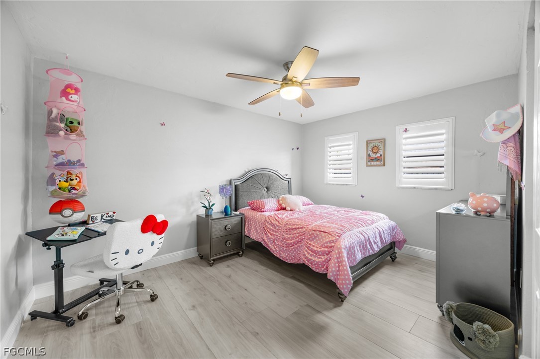 12991 Iona Road Fort Myers, FL 33908 - Photo 26 of 43 a bedroom with a bed and dresser