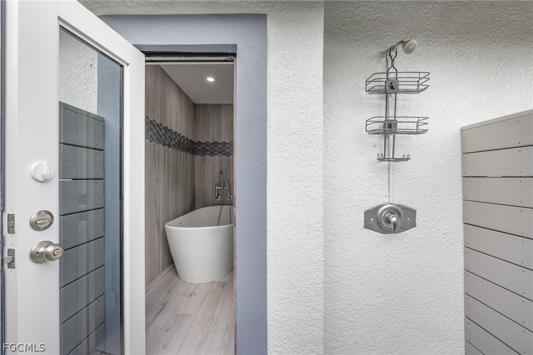 12991 Iona Road Fort Myers, FL 33908 - Photo 33 of 43 a bathroom with a shower
