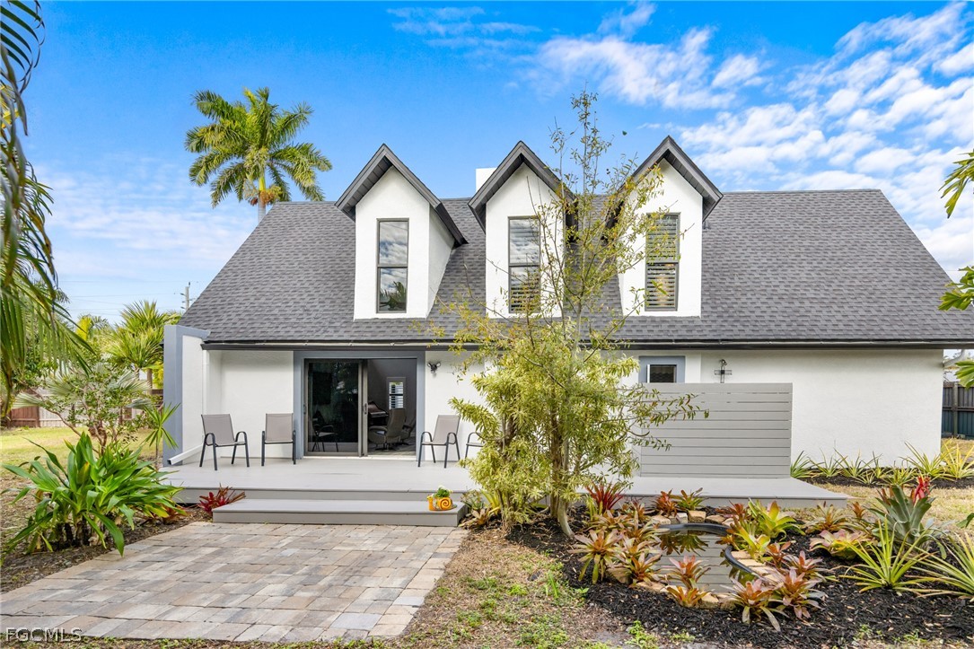 12991 Iona Road Fort Myers, FL 33908 - Photo 36 of 43 a front view of a house with garden