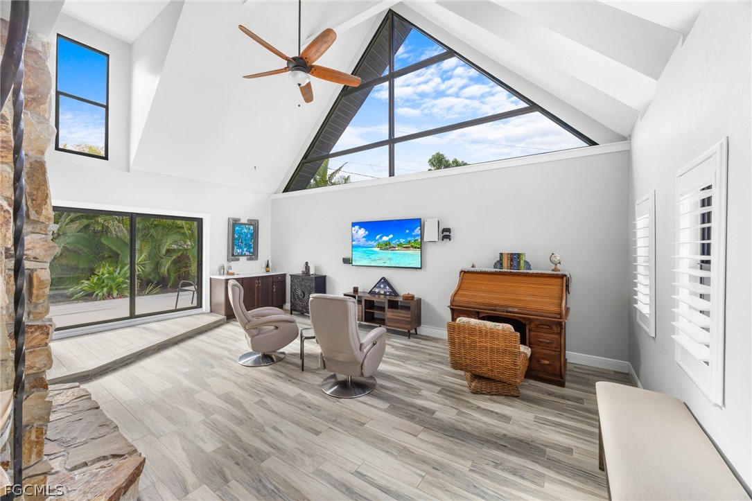 12991 Iona Road Fort Myers, FL 33908 - Photo 5 of 43 a living room with furniture a window and wooden floor