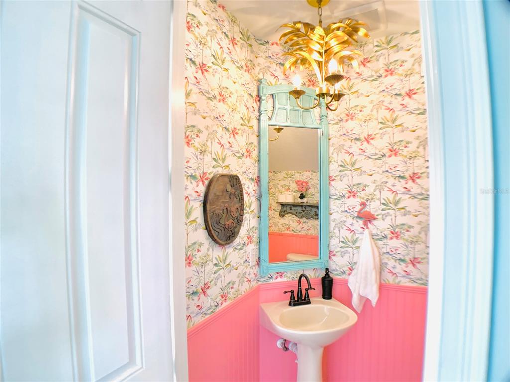 1424 Titian Court Reunion, FL 34747 - Photo 12 of 63 a bathroom with a sink and a mirror