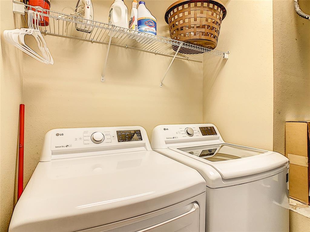 1424 Titian Court Reunion, FL 34747 - Photo 25 of 63 a utility room with dryer and washer