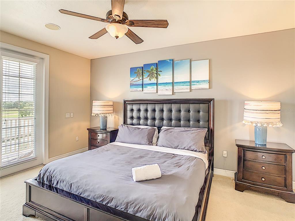 1424 Titian Court Reunion, FL 34747 - Photo 26 of 63 a bedroom with a bed and window