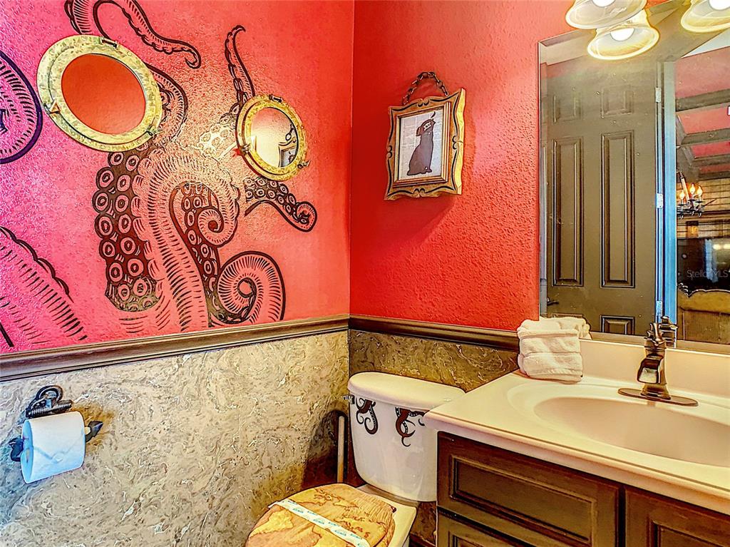 1424 Titian Court Reunion, FL 34747 - Photo 35 of 63 a bathroom with a sink mirror vanity and toilet