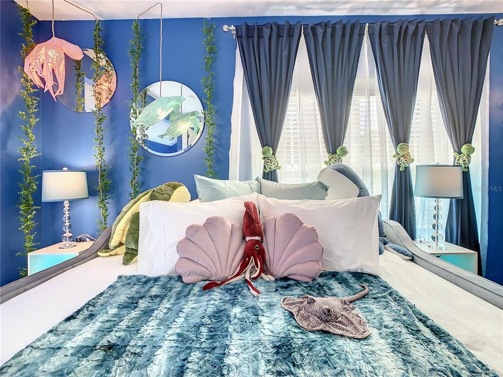 1424 Titian Court Reunion, FL 34747 - Photo 42 of 63 a bedroom with a bed dresser and a large window