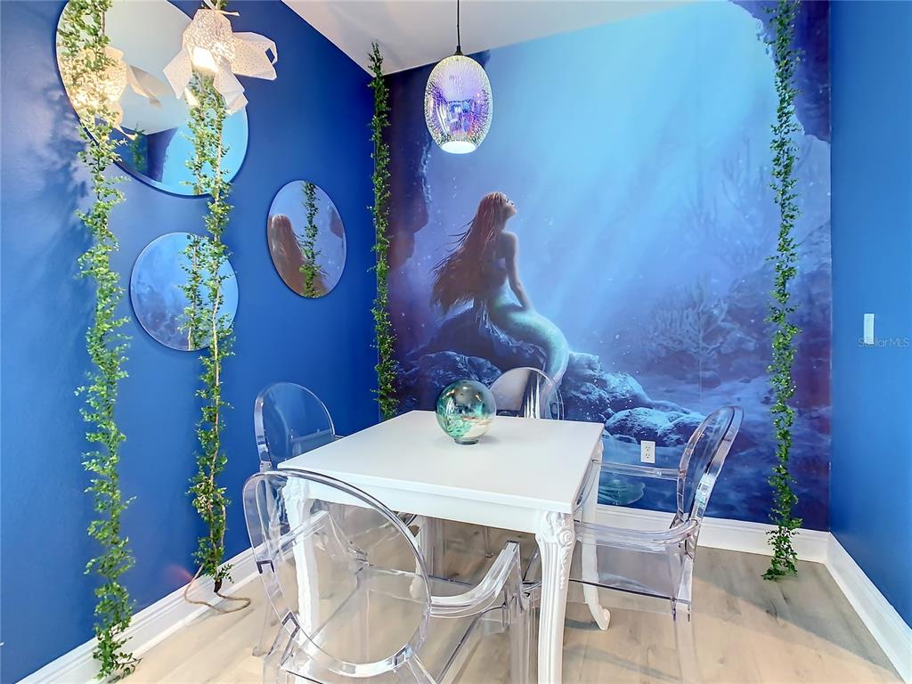 1424 Titian Court Reunion, FL 34747 - Photo 43 of 63 a view of a dining room with furniture and wooden floor